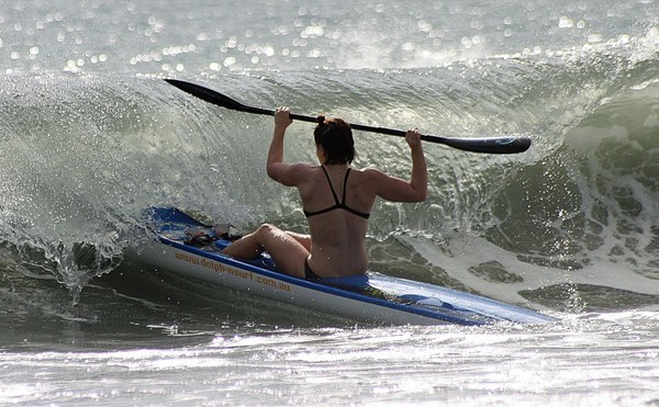 New Zealand's Jess Parr heads out in 3-foot surf at Taiwan's Sizihwan Bay yesterday during preparations for the World Games.